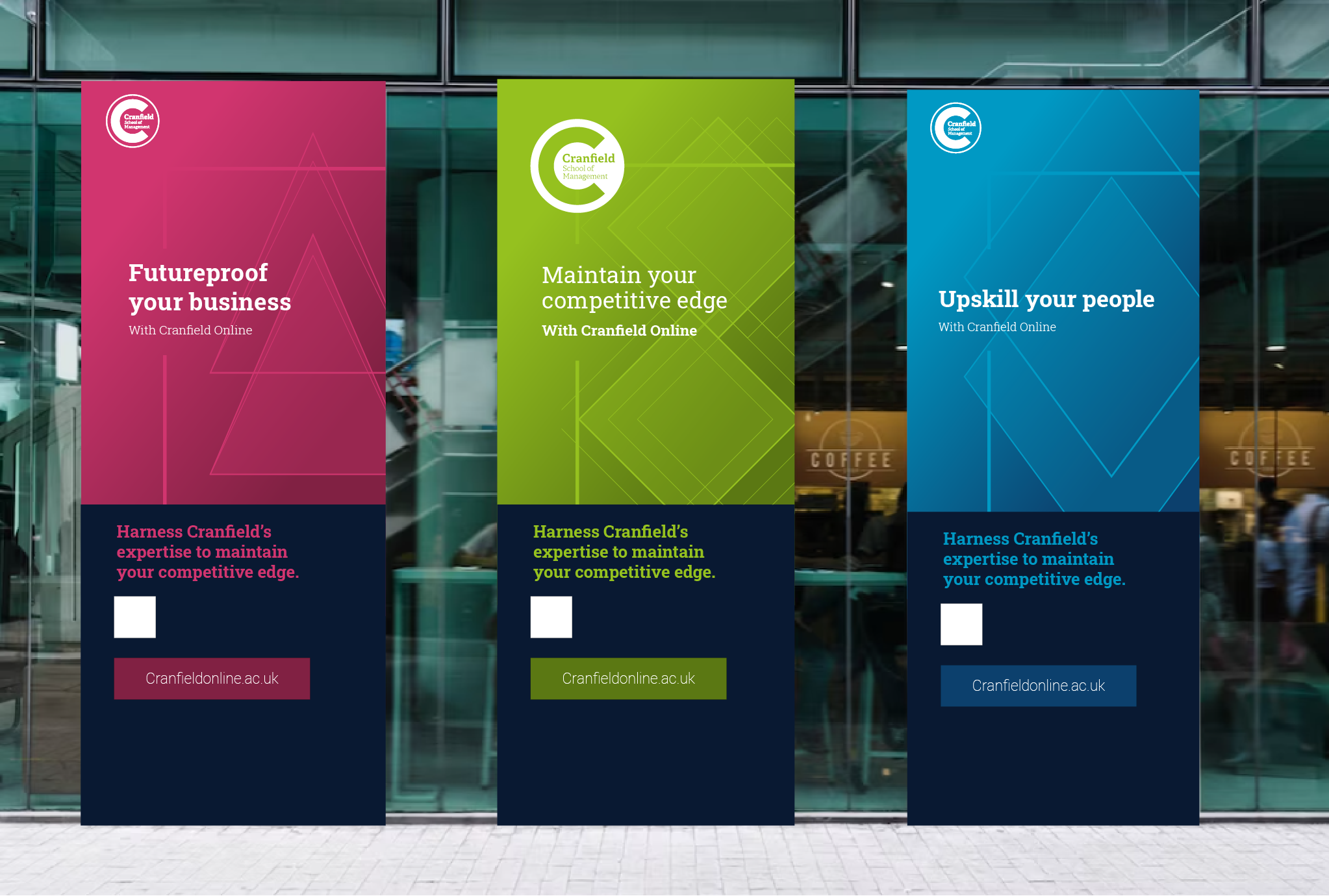 3 Cranfield Online pull-up banners in front of a glass-fronted building, exemplifying the visual brand identity.